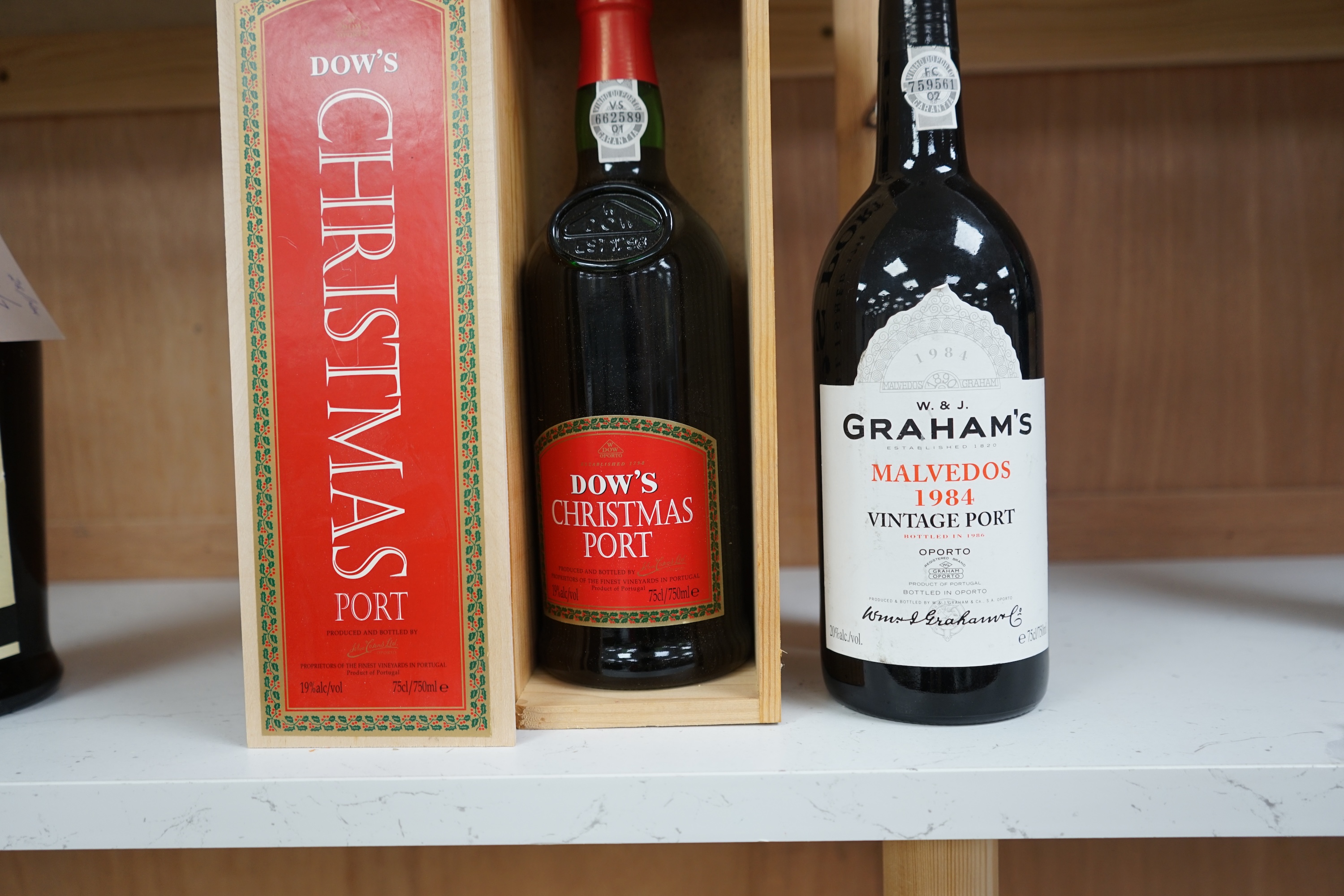 A bottle of Graham's Malvedas 1984 vintage port and a Dow's boxed Christmas port (2). Condition - good.